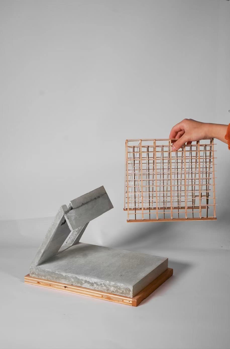 Physical model with the timber frame lifted away from the concrete base