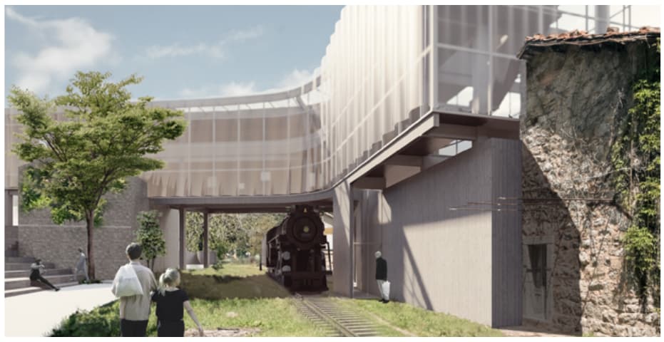 Courtyard view of railway tracks and a locomotive beneath a new elevated volume beside a stone building